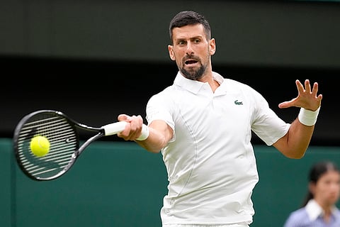 Novak Djokovic plays a forehand return